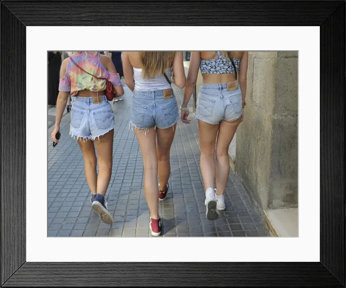 Framed Print : three girls bottoms wearing short jeans brisk walk through the city Framed Print : three girls bottoms wearing short jeans brisk walk through the city