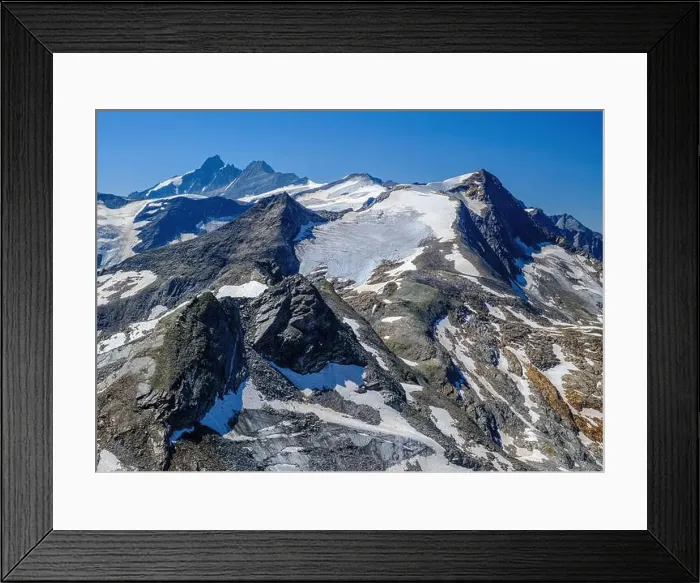 Framed Print : Kitzsteinhorn Glacier with rugged peaks under a clear blue sky. Aerial view. Kaprun, Zell Am See, Austrian Alps