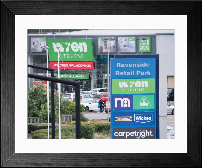 Framed Print : Wren Kitchens branch, Ravenside retail park, London, with signs for carpetright, Wickes, mothercare and toolstation Framed Print : Wren Kitchens branch, Ravenside retail park, London, with signs for carpetright, Wickes, mothercare and toolstation