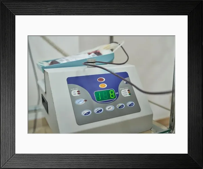 Framed Print : Closeup of blood collection mixer machine indicating volume of donor blood in medical laboratory Framed Print : Closeup of blood collection mixer machine indicating volume of donor blood in medical laboratory