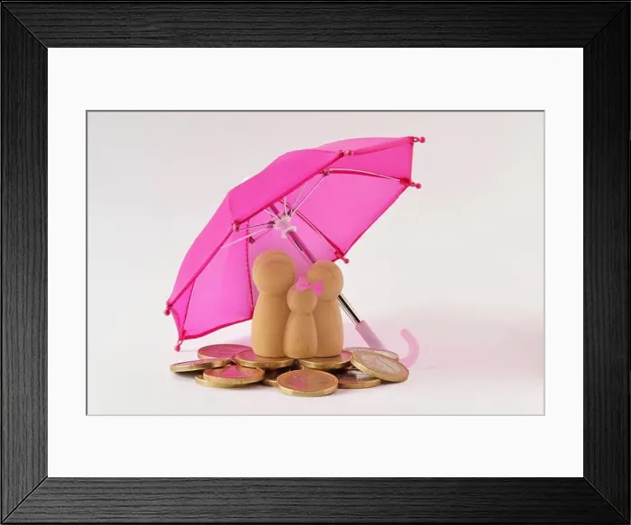 Framed Print : Family and pile of coins under umbrella - Concept of family and financial protection Framed Print : Family and pile of coins under umbrella - Concept of family and financial protection