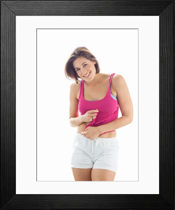 Framed Print : Portrait of Young Woman wearing Tank Top and Shorts in Studio Framed Print : Portrait of Young Woman wearing Tank Top and Shorts in Studio