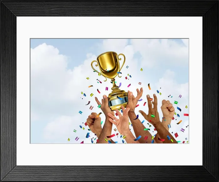Framed Print : Winning team and winner symbol as a Gold cup winner or trophy for teamwork success concept as a victory for first Framed Print : Winning team and winner symbol as a Gold cup winner or trophy for teamwork success concept as a victory for first