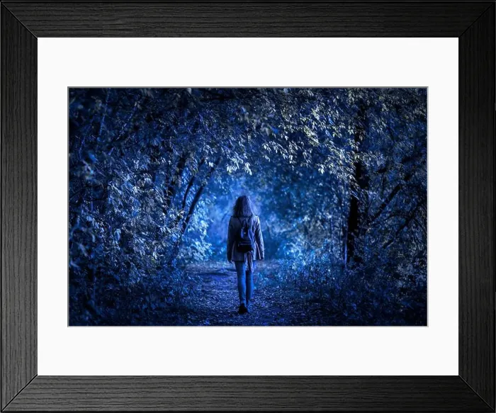 Framed Print : Dark forest on Halloween, young woman in fantasy spooky woods at night Framed Print : Dark forest on Halloween, young woman in fantasy spooky woods at night