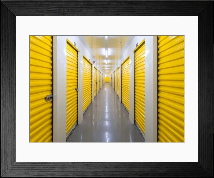 Framed Print : A long hallway containing many storage units inside a self storage building. Mississauga, Ontario, Canada Framed Print : A long hallway containing many storage units inside a self storage building. Mississauga, Ontario, Canada