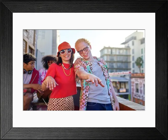 Framed Print : Portrait happy, carefree young couple on urban balcony