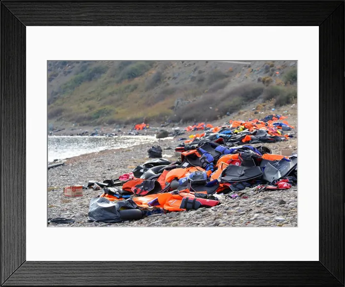 Framed Print : Lifejackets, rubber rings an pieces of the rubber dinghys discarded on a beach near Molyvos Framed Print : Lifejackets, rubber rings an pieces of the rubber dinghys discarded on a beach near Molyvos