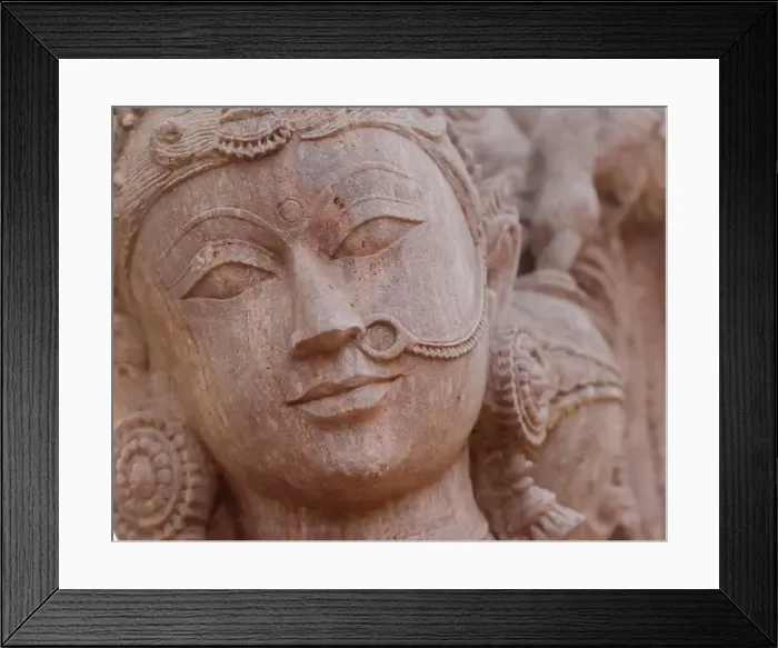 Framed Print : A closeup of an exquisitely carved granite statue of a woman wearing a nose ring Framed Print : A closeup of an exquisitely carved granite statue of a woman wearing a nose ring