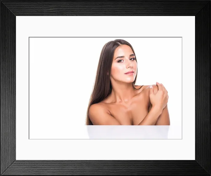 Framed Print : Beautiful girl with nude make up posing at grey studio background Framed Print : Beautiful girl with nude make up posing at grey studio background