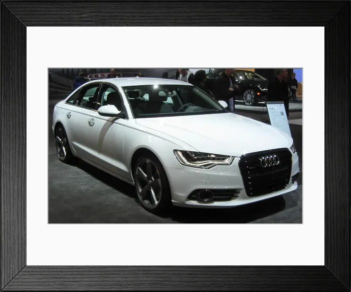 Framed Print : The 2011 Audi A6 sedan offers a luxury driving experience with its 3 Framed Print : The 2011 Audi A6 sedan offers a luxury driving experience with its 3