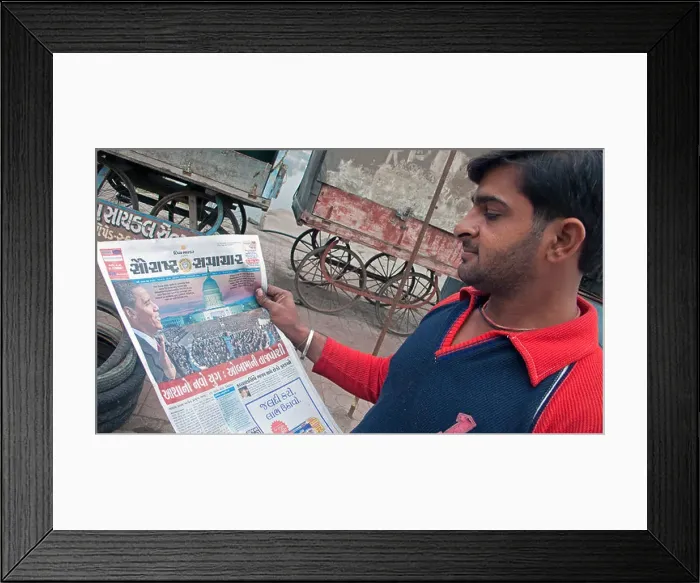 Framed Print : Man reading Gujarati newspaper story of Barack Obama US presidential inauguration Bhavnagar Gujarat India Framed Print : Man reading Gujarati newspaper story of Barack Obama US presidential inauguration Bhavnagar Gujarat India