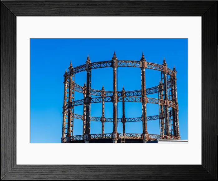 Framed Print : Old retro rusty Gas Holder or Gas tower against a blue sky in Great Yarmouth, Norfolk, UK