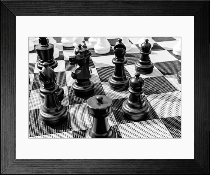 Framed Print : Vintage chessboard close up. Black and white photo Framed Print : Vintage chessboard close up. Black and white photo