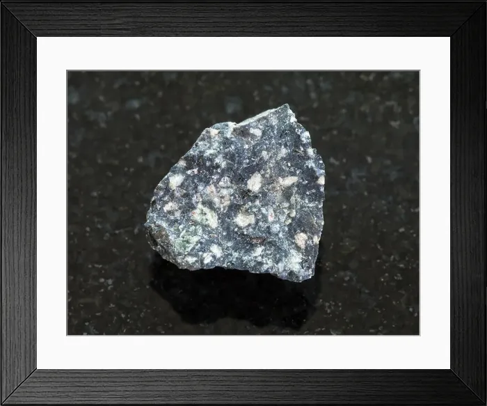 Framed Print : rough Andesite stone on dark background Framed Print : rough Andesite stone on dark background