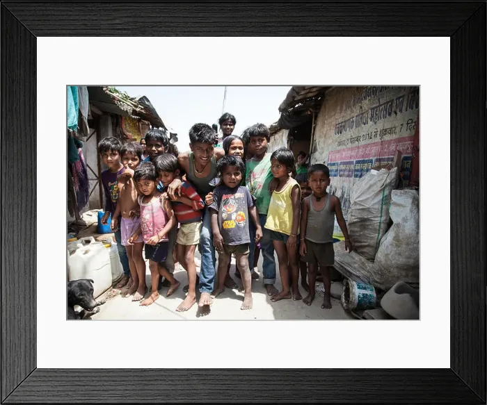 Framed Print : Group of children in the slum at the Ghazipur garbage dump, New Delhi, India Framed Print : Group of children in the slum at the Ghazipur garbage dump, New Delhi, India
