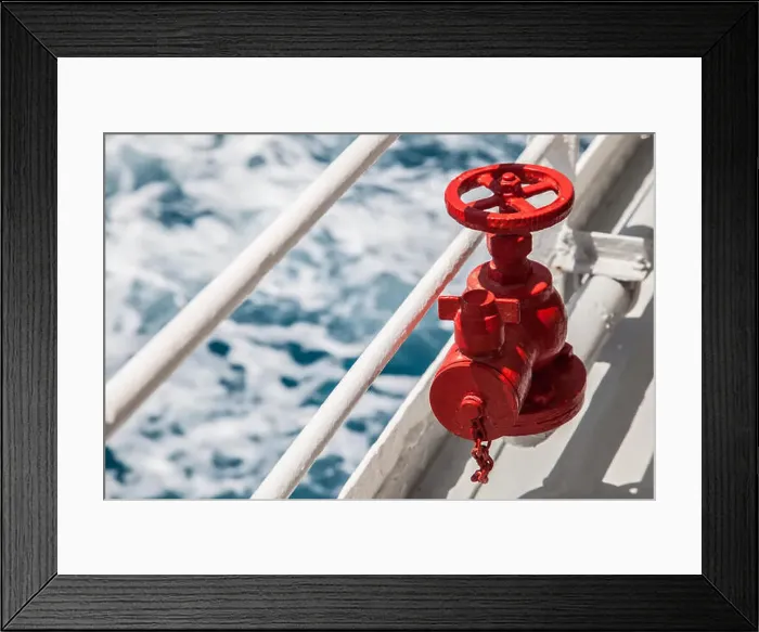 Framed Print : Red fire extinguisher with pipe connector on a boat with waves Framed Print : Red fire extinguisher with pipe connector on a boat with waves