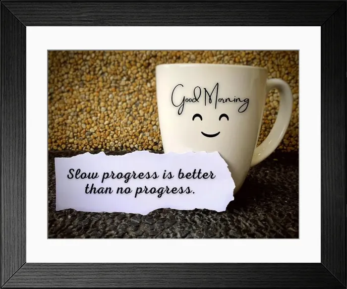 Framed Print : Good morning text on a coffee cup with motivational quote on a piece of paper - slow progress is better than no Framed Print : Good morning text on a coffee cup with motivational quote on a piece of paper - slow progress is better than no