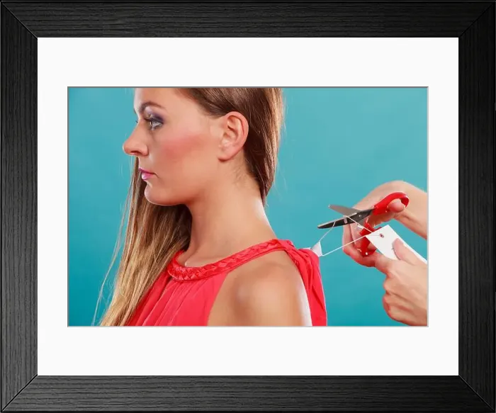 Framed Print : Woman girl removing cutting label board price tag off new dress cloth with scissors. Female after shopping Framed Print : Woman girl removing cutting label board price tag off new dress cloth with scissors. Female after shopping