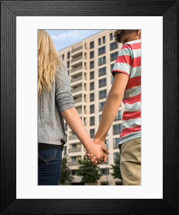 Framed Print : Teenage couple holding hands, close up Framed Print : Teenage couple holding hands, close up