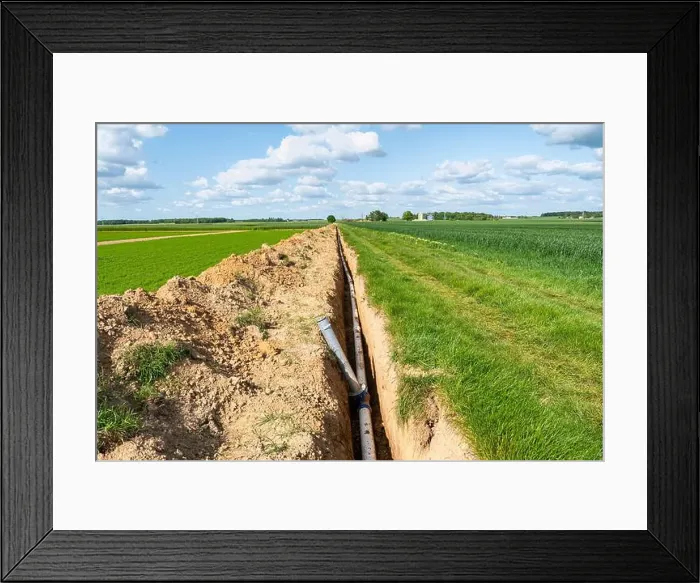 Framed Print : Installation of irrigation pipes, farm irrigation system. Buried pipes at the edge of a field, sprinkler system Framed Print : Installation of irrigation pipes, farm irrigation system. Buried pipes at the edge of a field, sprinkler system