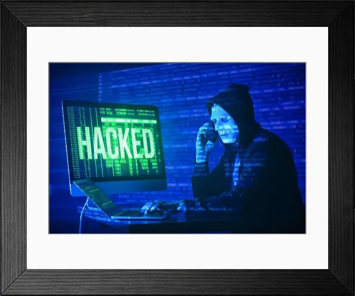 Framed Print : Hacker with mobile phone using computer in dark room Framed Print : Hacker with mobile phone using computer in dark room