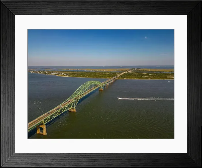 Framed Print : An aerial view of the Fire Island Inlet Bridge and the Robert Moses Causeway on a sunny day on Long Island, New York Framed Print : An aerial view of the Fire Island Inlet Bridge and the Robert Moses Causeway on a sunny day on Long Island, New York