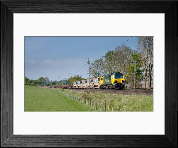 Framed Print : Freightliner GE class 70 diesel locomotive 70016 on the electrified west coast mainline with a freight train carrying Framed Print : Freightliner GE class 70 diesel locomotive 70016 on the electrified west coast mainline with a freight train carrying