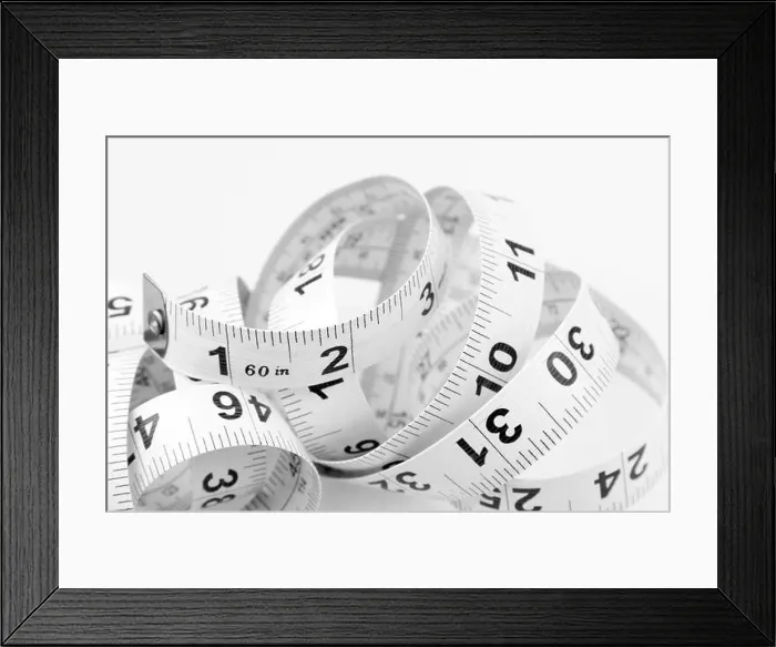 Framed Print : Closeup of coiled measuring tape Framed Print : Closeup of coiled measuring tape