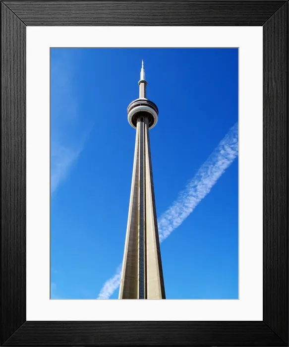 Framed Print : Famous Canadian landmark CN Tower against blue sky Framed Print : Famous Canadian landmark CN Tower against blue sky