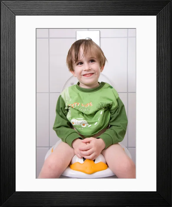Framed Print : little boy sitting on the toilet