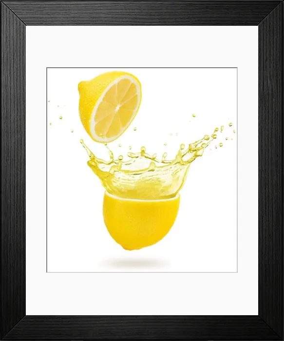 Framed Print : yellow juice exploding out of a lemon isolated on white background Framed Print : yellow juice exploding out of a lemon isolated on white background