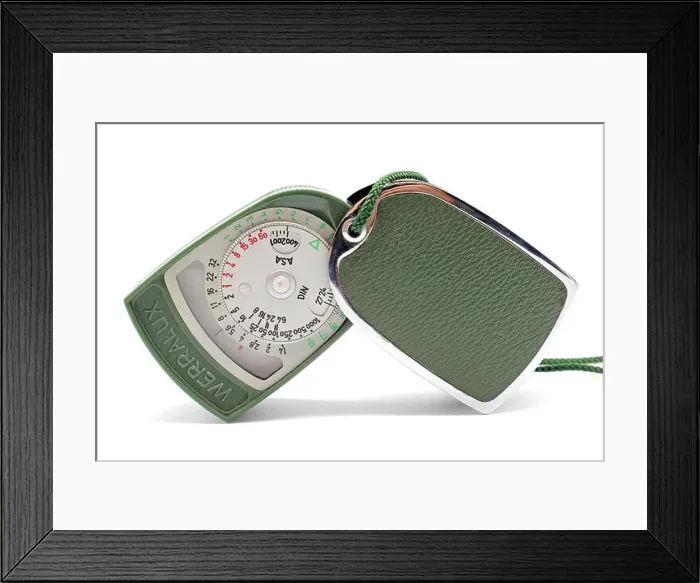 Framed Print : Vintage photographic light meter Werralux made in Germany early 60s, isolated on white background, close-up