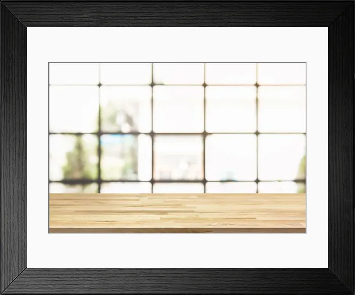 Framed Print : Wood table top with blur bright square transparent window of cafe in background - can be used for display your products Framed Print : Wood table top with blur bright square transparent window of cafe in background - can be used for display your products