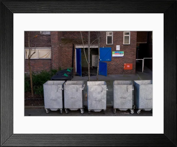 Framed Print : Metal rubbish bins on wheels, housing estate, London Framed Print : Metal rubbish bins on wheels, housing estate, London