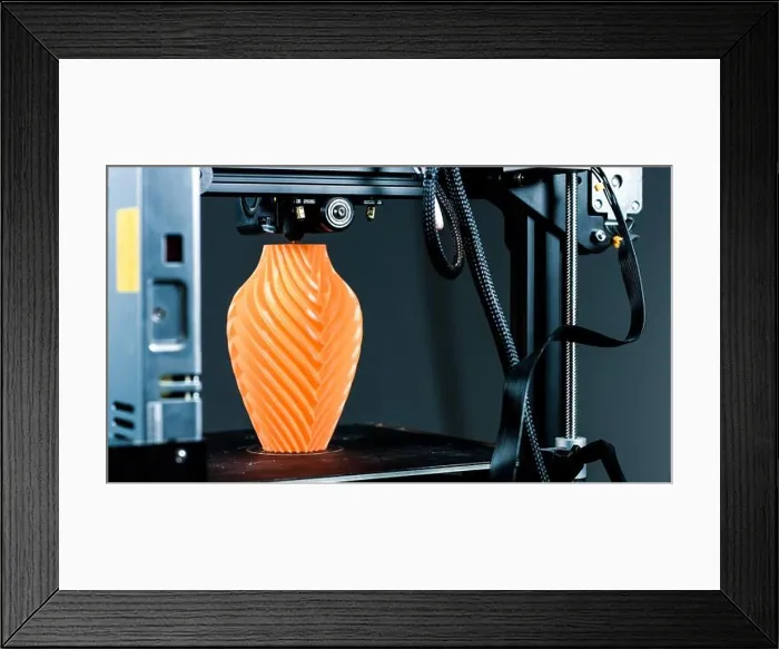 Framed Print : 3D Printer printing a vase for home decoration with orange plastic Filament