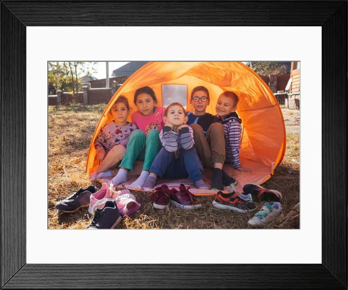 Framed Print : Happy kids - boys and girls in a tent outdoor Framed Print : Happy kids - boys and girls in a tent outdoor