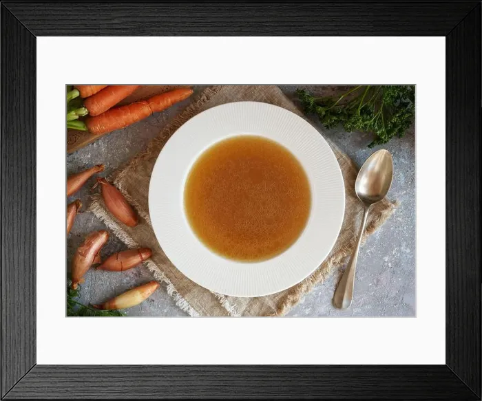 Framed Print : White plate or soup bowl with beef bone broth, with fresh vegetables in the background Framed Print : White plate or soup bowl with beef bone broth, with fresh vegetables in the background