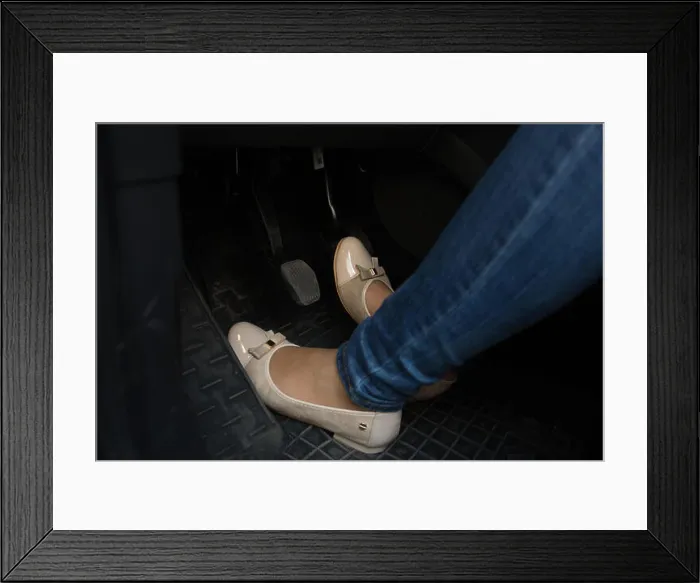 Framed Print : Closeup photo of female driver feet on car pedals Framed Print : Closeup photo of female driver feet on car pedals