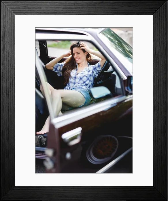 Framed Print : Smiling girl in short shorts in open car, tinted photo Framed Print : Smiling girl in short shorts in open car, tinted photo