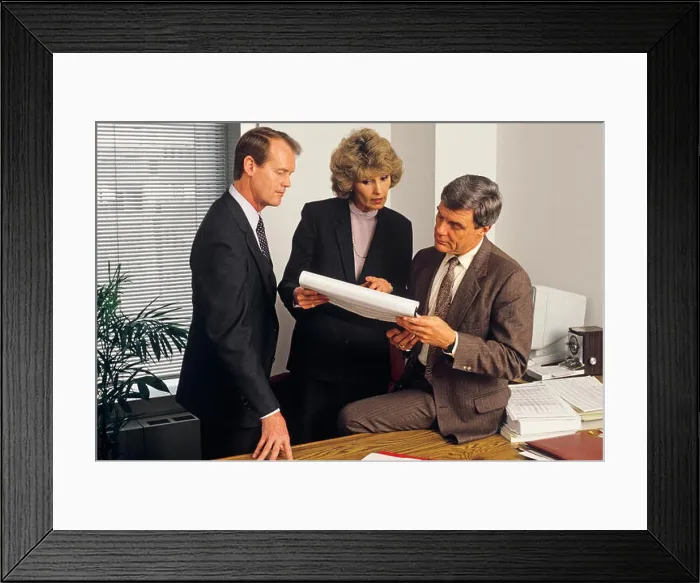 Framed Print : 1980s 3 EXECUTIVES HOLDING MEETING IN OFFICE REVIEWING PAPER WORK SPREAD SHEET - ko2797 NET002 HARS LEADER INFORMATION Framed Print : 1980s 3 EXECUTIVES HOLDING MEETING IN OFFICE REVIEWING PAPER WORK SPREAD SHEET - ko2797 NET002 HARS LEADER INFORMATION