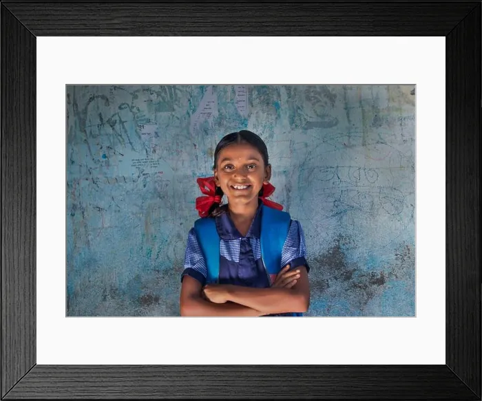 Framed Print : portrait of a rural school girl Smiling and standing in School Framed Print : portrait of a rural school girl Smiling and standing in School