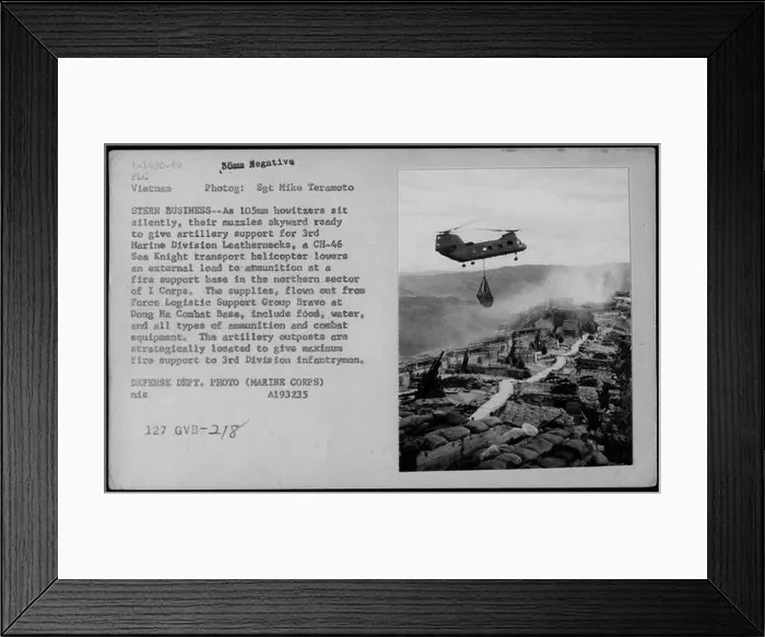 Framed Print : A CH-46 Sea Knight transport helicopter lowers external supplies Framed Print : A CH-46 Sea Knight transport helicopter lowers external supplies