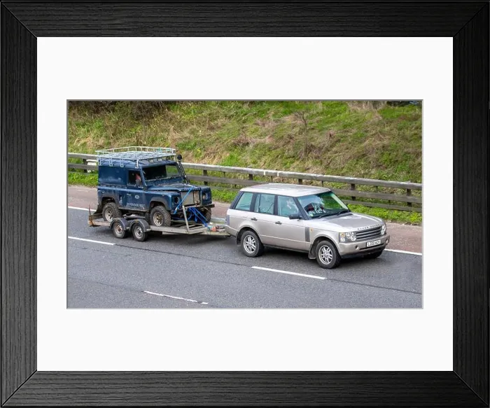 Framed Print : Range Rover towing decrepit dilapidated old Land Rover Defender Framed Print : Range Rover towing decrepit dilapidated old Land Rover Defender