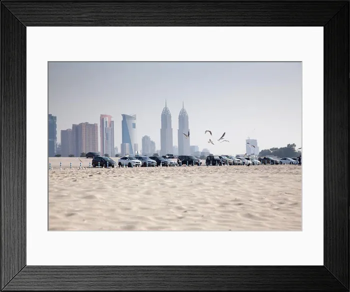 Framed Print : DUBAI, UAE - FEBRUARY 2018: A view of Dubai skyscrapers from black palace public beach Framed Print : DUBAI, UAE - FEBRUARY 2018: A view of Dubai skyscrapers from black palace public beach