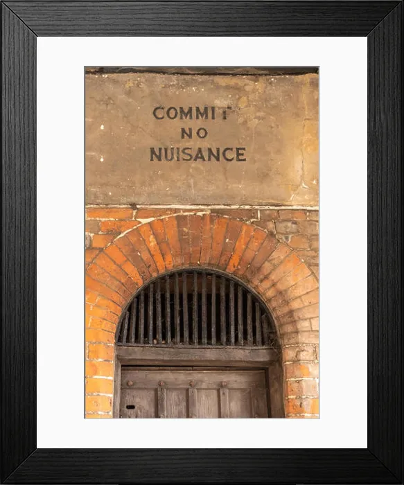 Framed Print : Notice reading 'commit no nuisance' above the old town lock-up inside the historic 17th century market hall in Amersham Framed Print : Notice reading 'commit no nuisance' above the old town lock-up inside the historic 17th century market hall in Amersham