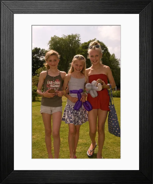 Framed Print : Three 11 year old girls having fun at a summer fete, East Meon, Hampshire, UK Framed Print : Three 11 year old girls having fun at a summer fete, East Meon, Hampshire, UK