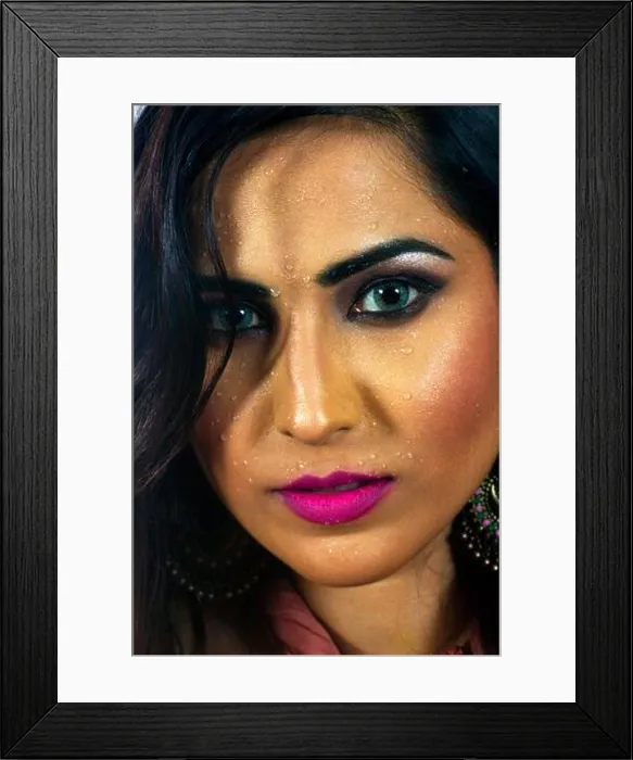 Framed Print : Indian Model face closeup looking at camera and water on face Framed Print : Indian Model face closeup looking at camera and water on face