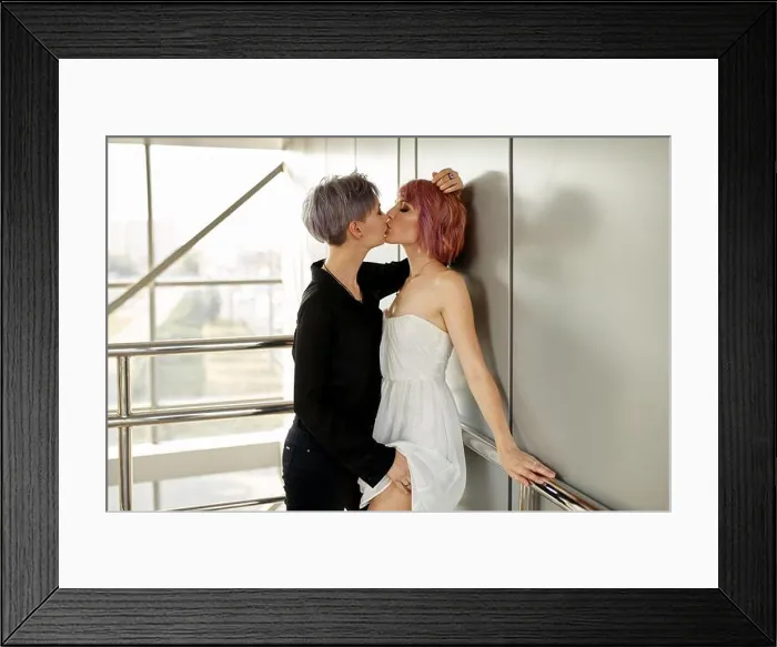 Framed Print : Beautiful lesbian couple hugging. Love and passion between the two girls. summertime