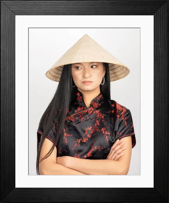 Framed Print : Portrait of Asian woman wearing cone-shaped Asian cane hat Framed Print : Portrait of Asian woman wearing cone-shaped Asian cane hat