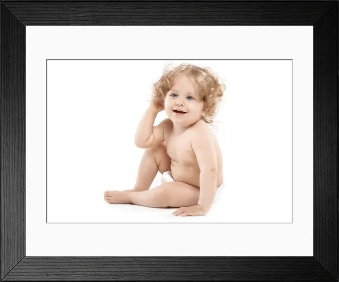 Framed Print : Pretty girl in diaper on a white background